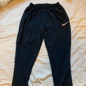 Dark blue Nike Men's Dri-FIT Essential Woven Pocket Running Pants size L.
